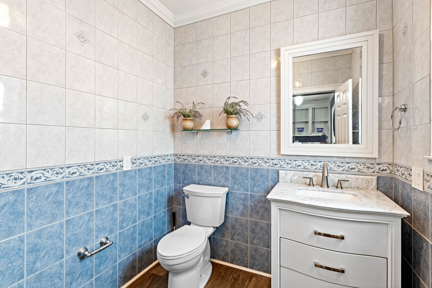 half bath with sink cabinet and toilet